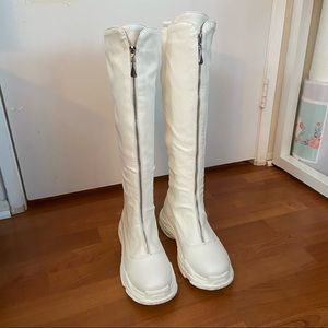 Knee high front zip sneaker boots